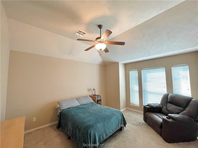 carpeted bedroom featuring ceiling fan and lofted ceiling