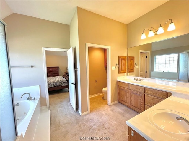 bathroom with toilet, a bath, vanity, and vaulted ceiling