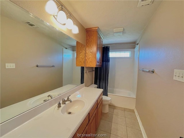 full bathroom with tile patterned floors, a textured ceiling, vanity, shower / bath combo with shower curtain, and toilet