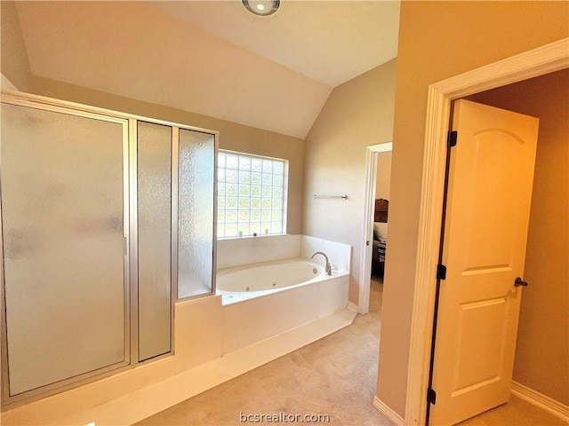 bathroom featuring shower with separate bathtub and lofted ceiling