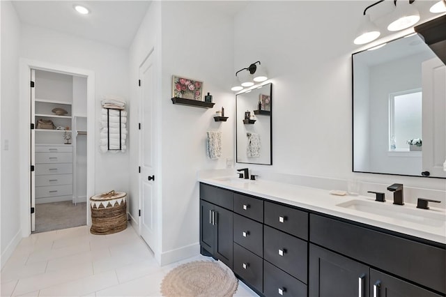 bathroom with tile patterned floors and vanity