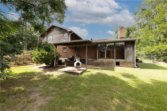 910 Briar Cliff Dr, Bryan, TX 77802 - back of house with a patio and a chimney