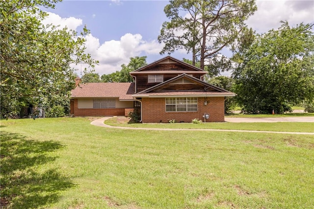 910 Briar Cliff Dr, Bryan, TX 77802 - view of front of home with brick siding and a front lawn