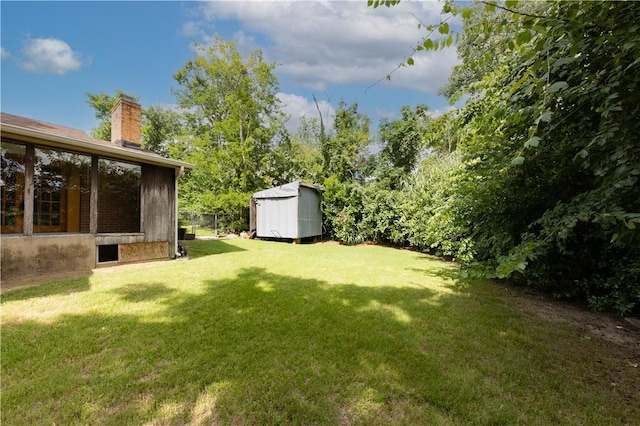 910 Briar Cliff Dr, Bryan, TX 77802 - view of green lawn featuring a storage unit