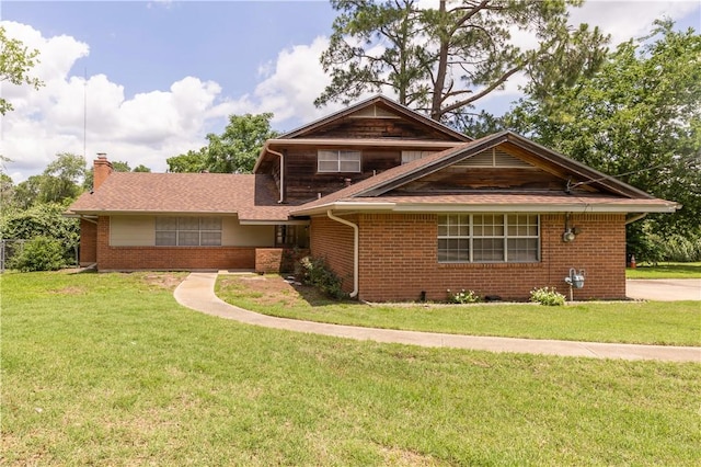 910 Briar Cliff Dr, Bryan, TX 77802 - view of front of property with brick siding, a front lawn, and a chimney