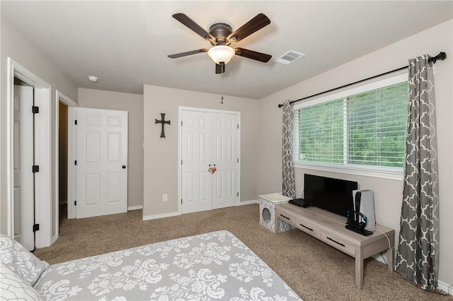 1607 Culture Ln, College Station, TX 77845 - carpeted bedroom with baseboards, a ceiling fan, a closet, and visible vents