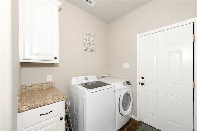 1607 Culture Ln, College Station, TX 77845 - washroom featuring cabinet space, baseboards, visible vents, and washing machine and dryer