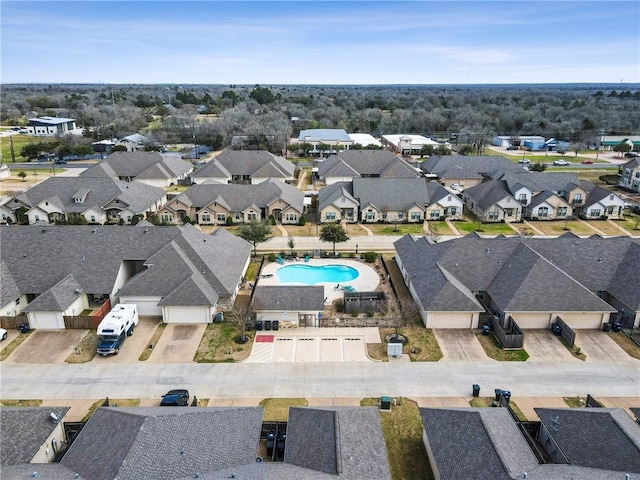 birds eye view of property with a residential view