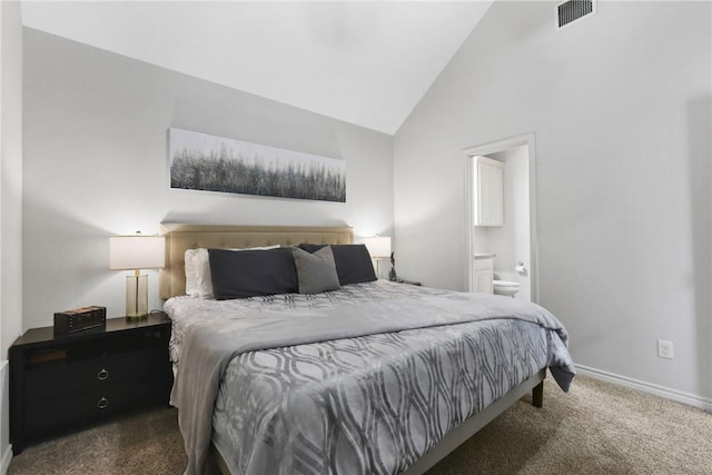 carpeted bedroom featuring lofted ceiling, visible vents, baseboards, and ensuite bathroom