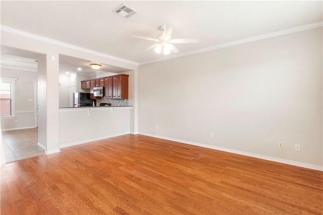 unfurnished living room featuring light hardwood / wood-style flooring, ceiling fan, and crown molding