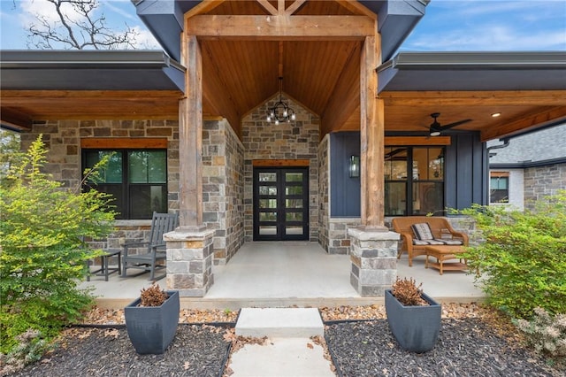 doorway to property with ceiling fan and a porch