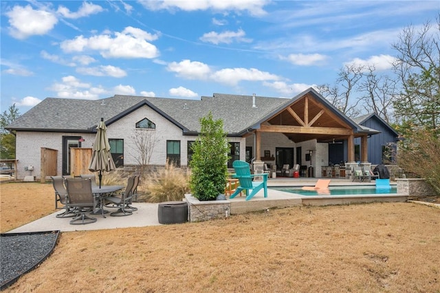 rear view of property featuring a patio