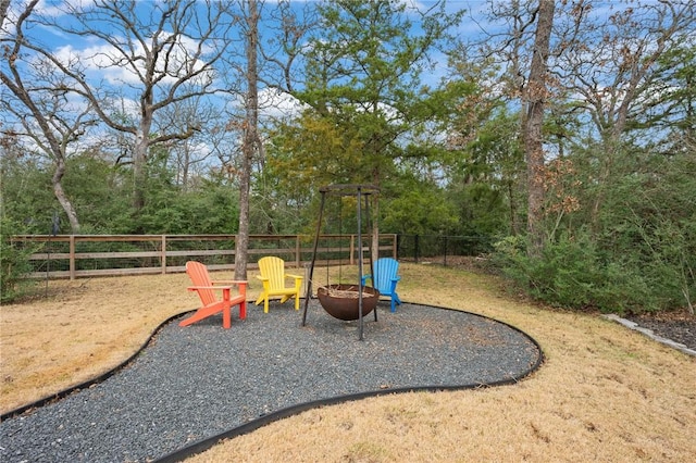 view of jungle gym featuring an outdoor fire pit