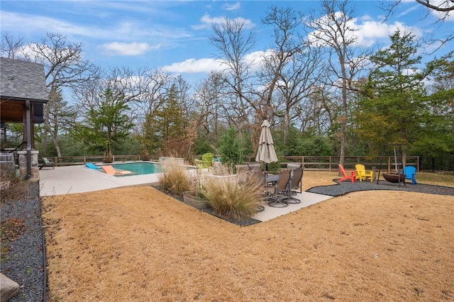 exterior space with a patio area and a fenced in pool