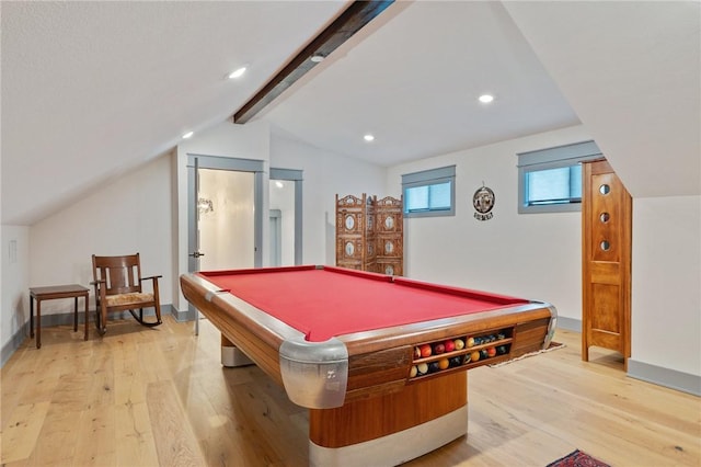 game room with light wood-type flooring, pool table, and vaulted ceiling with beams