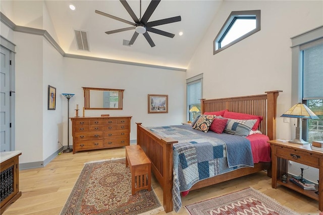 bedroom featuring ceiling fan, high vaulted ceiling, and light hardwood / wood-style floors