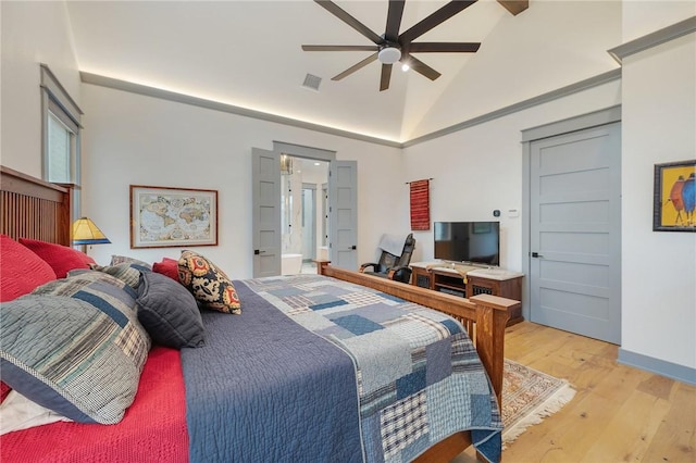 bedroom with light wood-type flooring, lofted ceiling, and ceiling fan