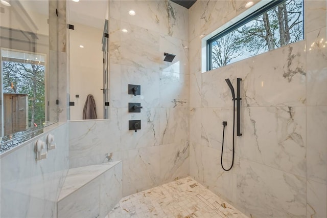 bathroom featuring tiled shower