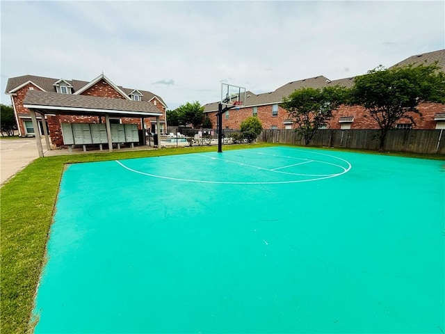 view of basketball court with fence and community basketball court