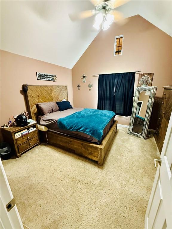 bedroom featuring carpet, ceiling fan, and lofted ceiling