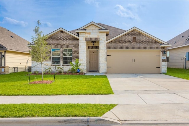 2110 Chief St, Bryan, TX 77807 - view of front facade featuring a garage, a front lawn, driveway, and brick siding