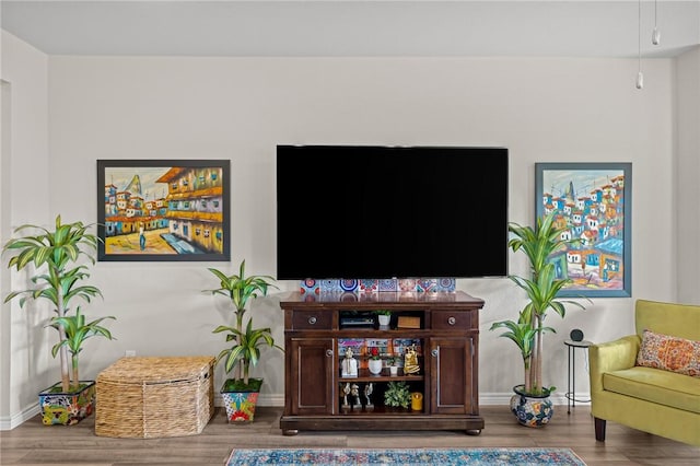 2110 Chief St, Bryan, TX 77807 - living area featuring wood finished floors and baseboards