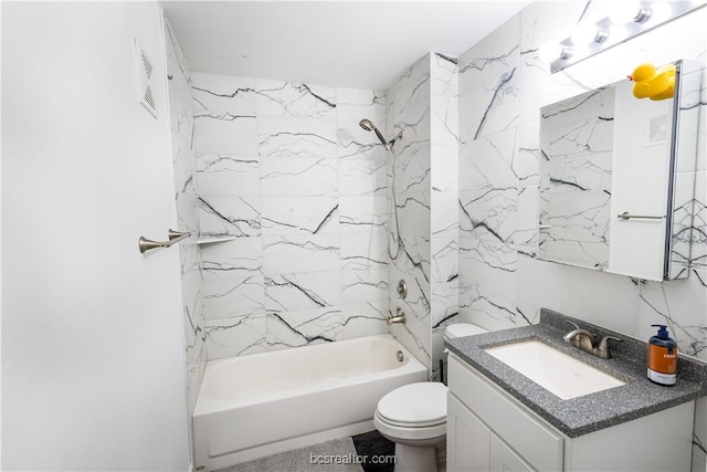 full bathroom with vanity, toilet, and tiled shower / bath