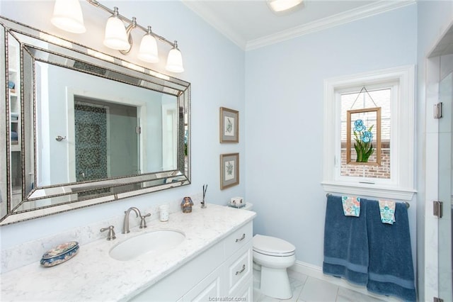 bathroom with toilet, vanity, and ornamental molding