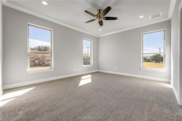 unfurnished room with ceiling fan, a healthy amount of sunlight, and ornamental molding