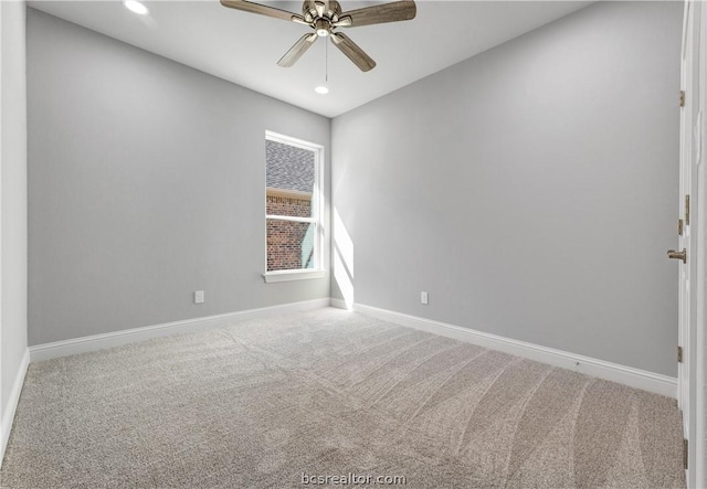 spare room with ceiling fan and carpet floors