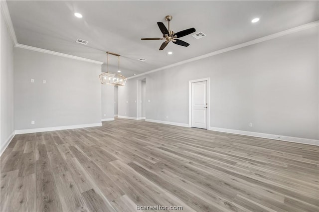 unfurnished living room with light hardwood / wood-style floors, ceiling fan, and crown molding