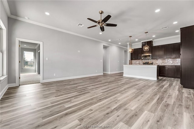 unfurnished living room featuring light hardwood / wood-style flooring, ceiling fan, and ornamental molding