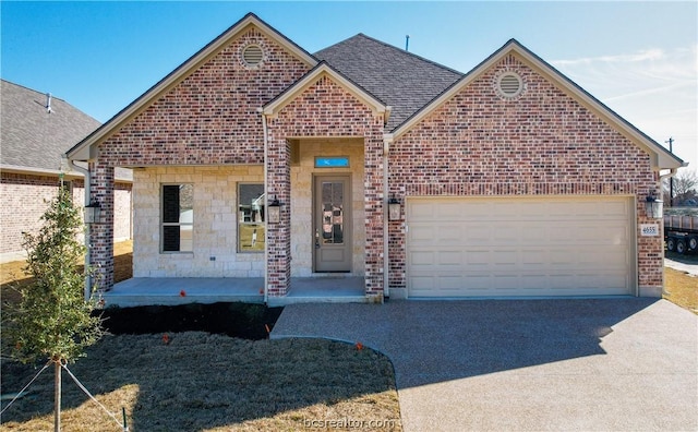 view of front facade with covered porch and a garage