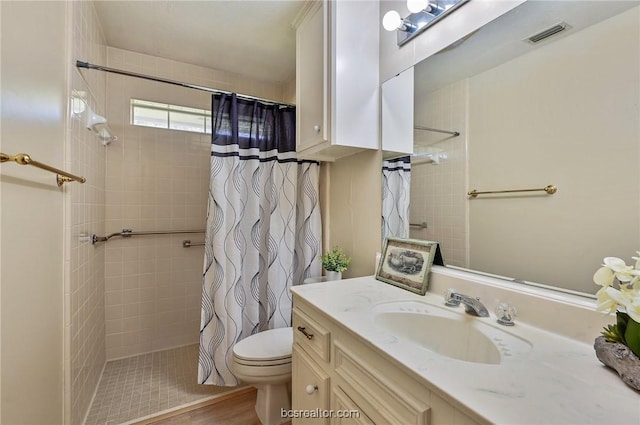 bathroom with hardwood / wood-style flooring, vanity, curtained shower, and toilet