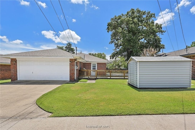 view of front of house featuring a garage and a front lawn