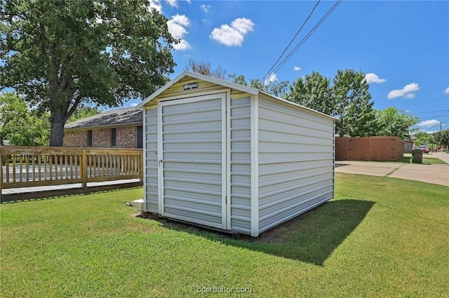 view of outdoor structure with a lawn