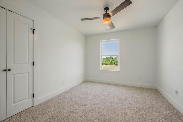 3034 Teller Dr, Bryan, TX 77808 - spare room featuring light colored carpet, a ceiling fan, and baseboards
