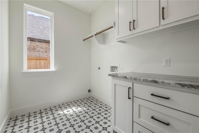 3034 Teller Dr, Bryan, TX 77808 - washroom featuring hookup for an electric dryer, cabinet space, baseboards, and hookup for a washing machine