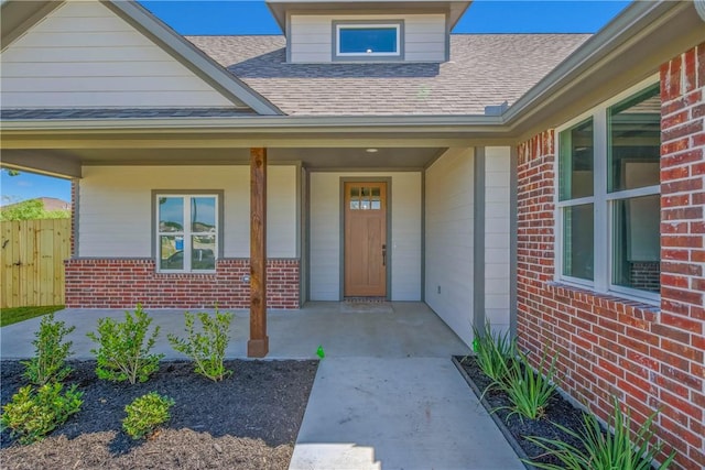 3034 Teller Dr, Bryan, TX 77808 - doorway to property with brick siding and a shingled roof