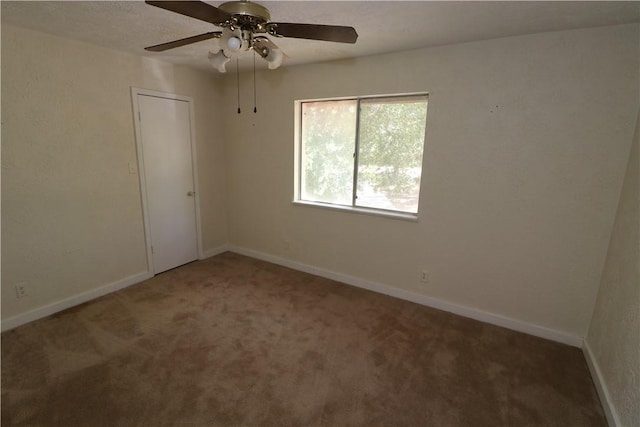 carpeted empty room with ceiling fan