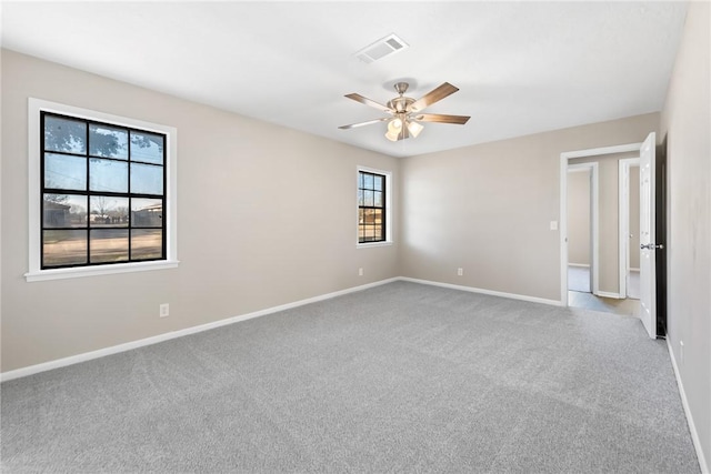 carpeted empty room featuring ceiling fan