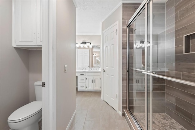 bathroom with toilet, a shower with shower door, tile patterned flooring, ornamental molding, and vanity