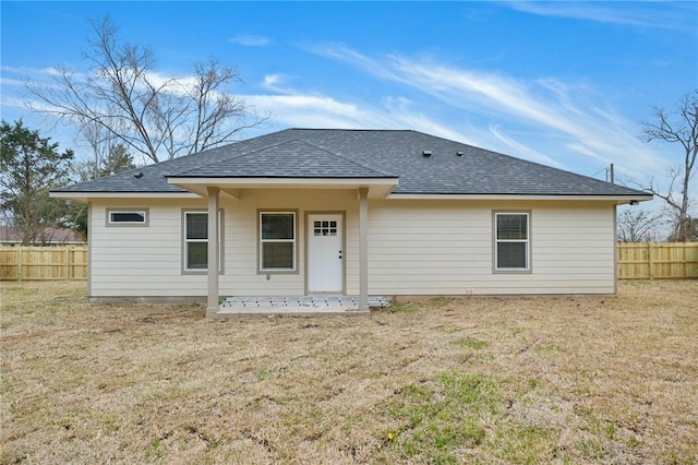 back of house with a yard