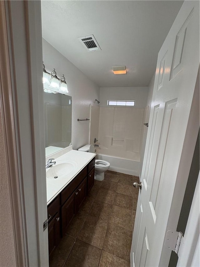 full bathroom with washtub / shower combination, tile patterned floors, vanity, and toilet