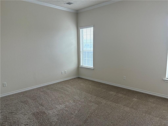 unfurnished room featuring carpet floors and ornamental molding