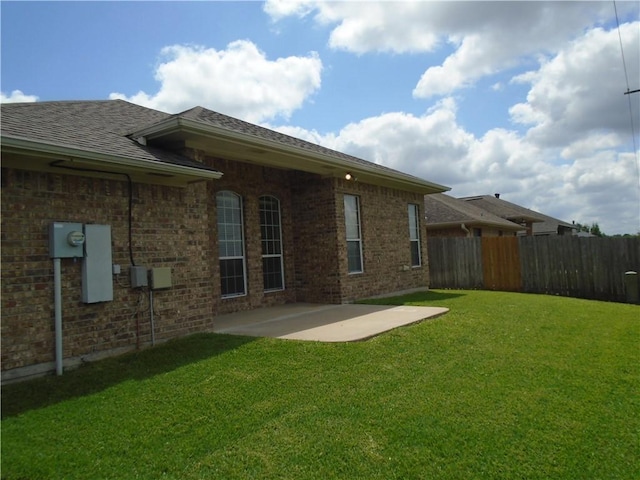 3718 Dove Hollow Ln, College Station, TX 77845 - back of house with a patio area, brick siding, and roof with shingles