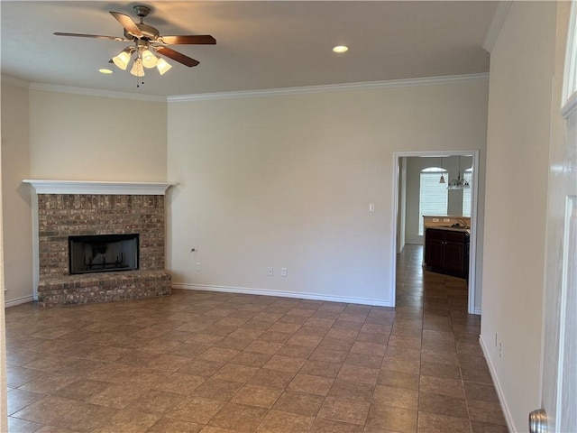 unfurnished living room with a fireplace, ceiling fan with notable chandelier, crown molding, and tile patterned flooring