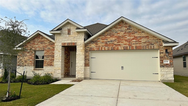 front of property featuring a front yard and a garage