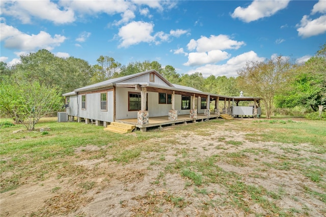 23405 Martha Williams Rd, Montgomery, TX 77356 - view of front of home with cooling unit, a wooden deck, and a carport