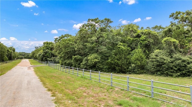 206 22 Hills Rd, Gause, TX 77857 - view of asphalt street with a forest view